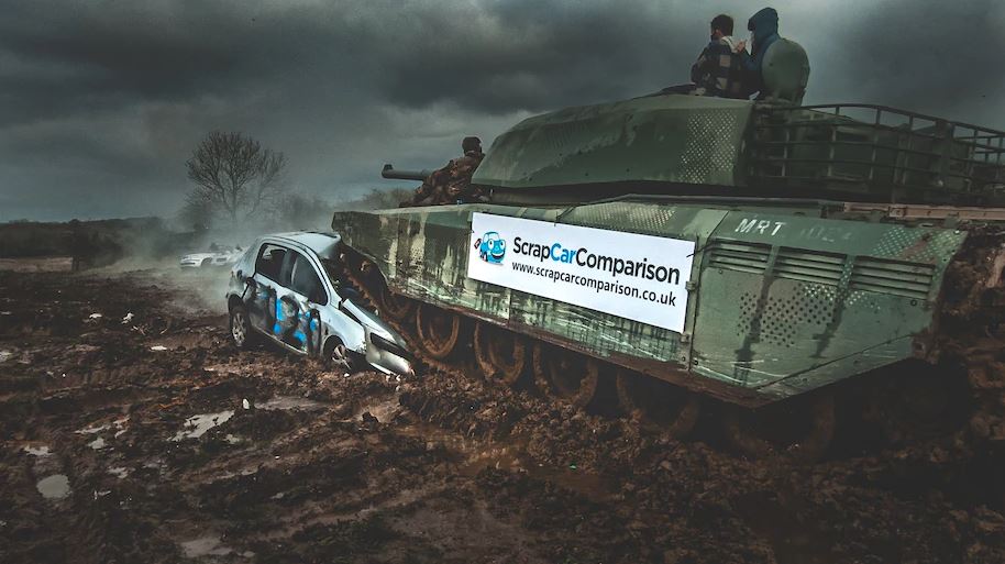 Tank crushing a scrap car