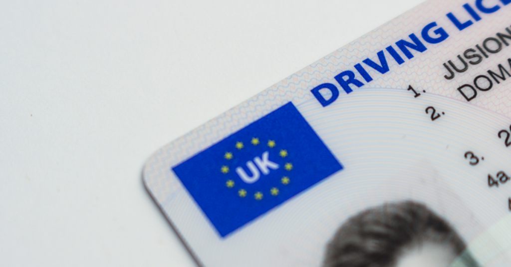 A close up of the corner of a UK driver's license.